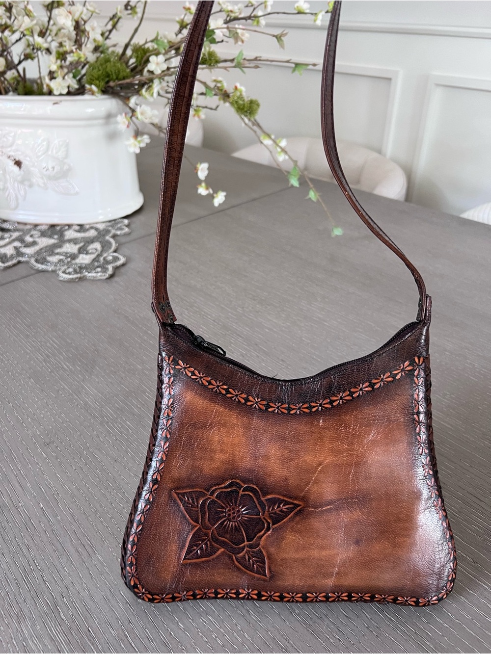 Hand-Tooled Brown Leather Shoulder Bag with Floral Motif